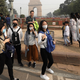 Foreign tourists visiting India Gate in New Delhi on Nov. 12.